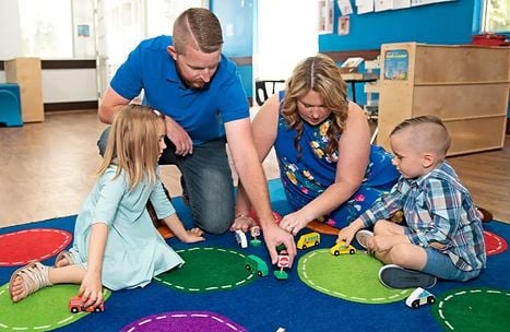 family playing in daycare