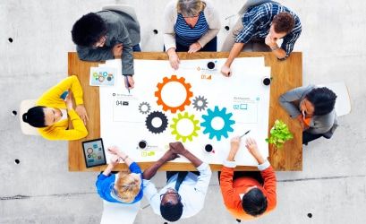 People brainstorming at a table image